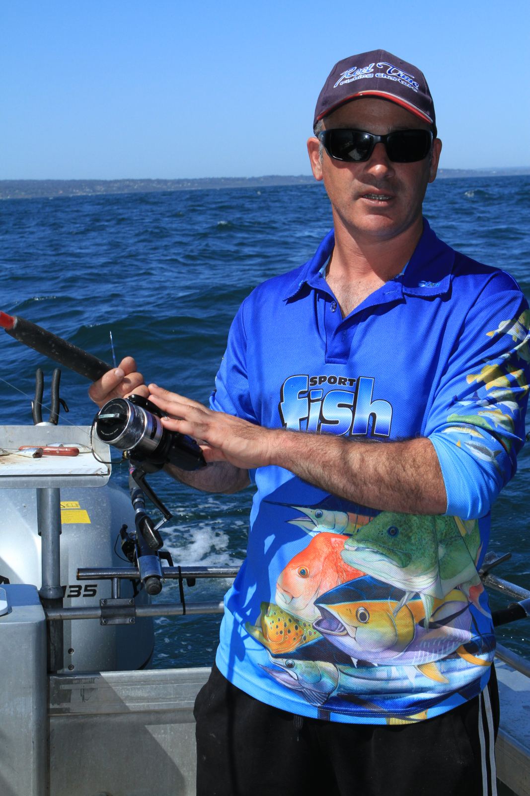 Matt Cini on the water with rod and reel